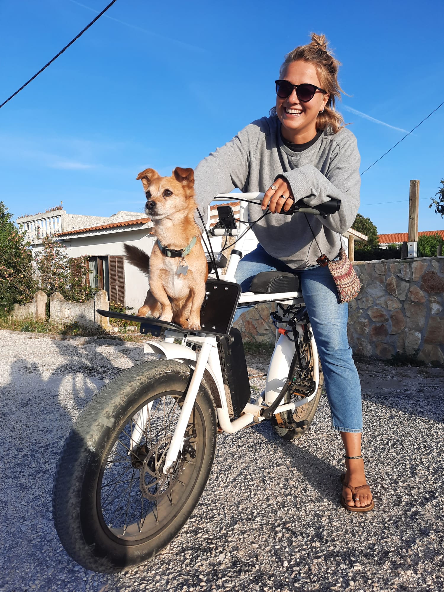 Girl on an e-fat ebike on the road near Carrapateira